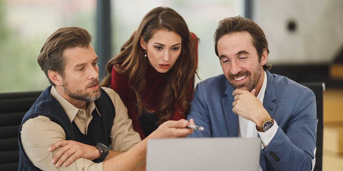 Three people looking at the about us page on Grace bookkeeping website